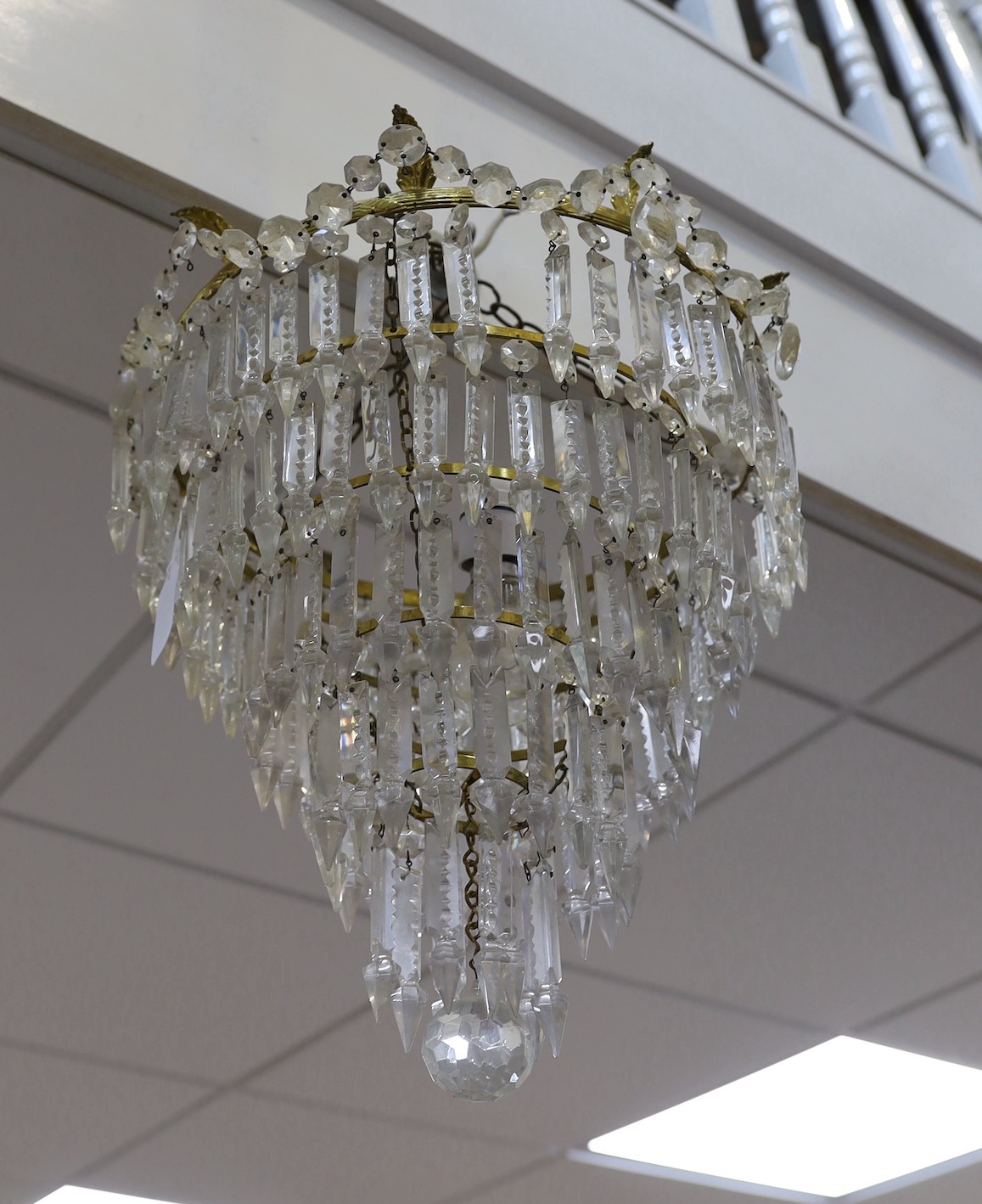 A large five tier graduated glass lustre chandelier